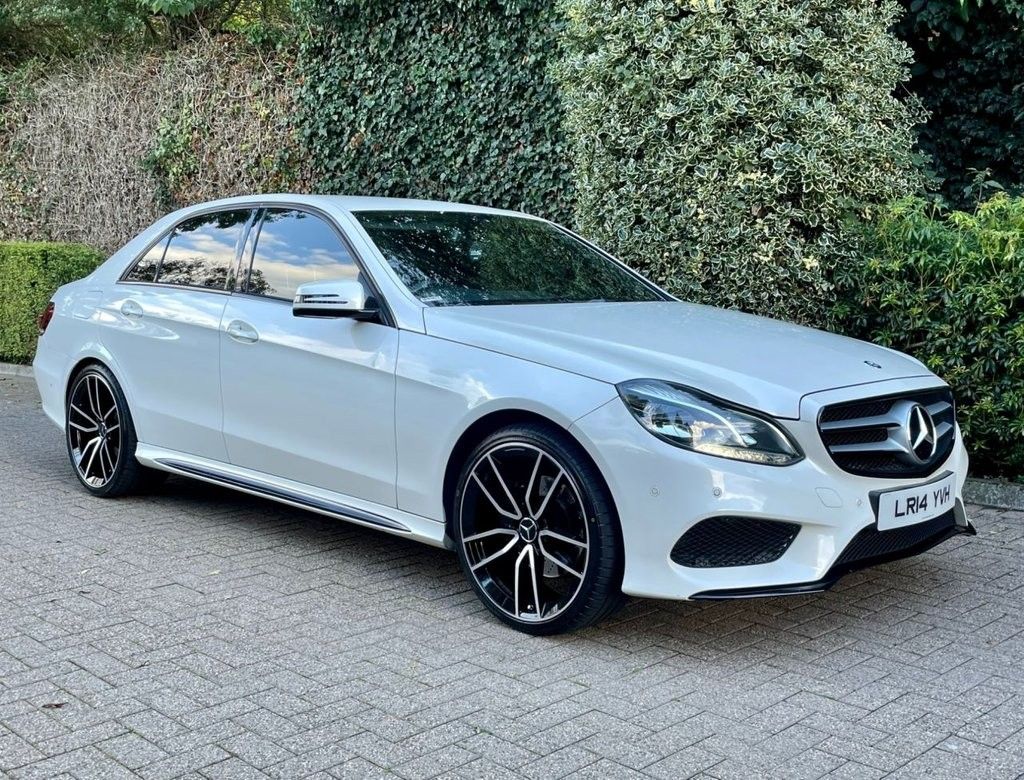 White Mercedes-Benz E-Class W212 facelift parked roadside